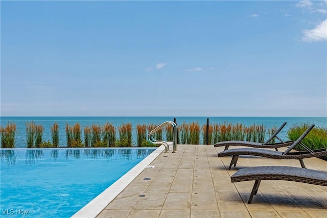 view of pool featuring a water view