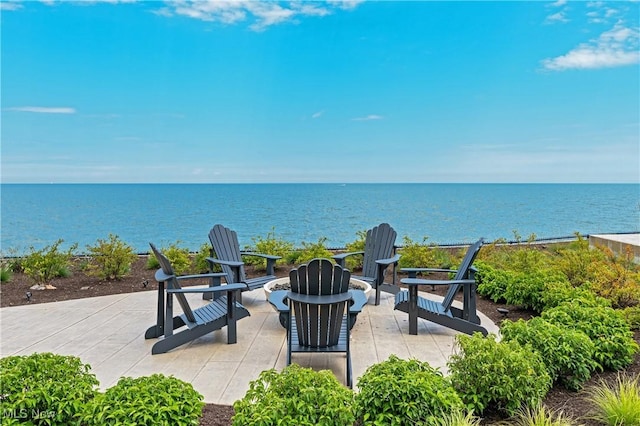 view of patio with a water view