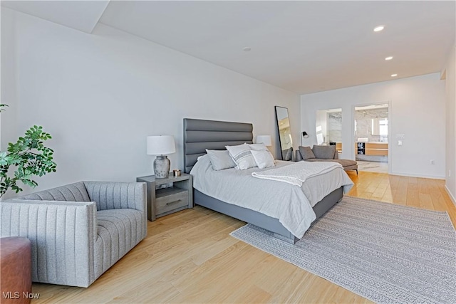 bedroom with light hardwood / wood-style flooring