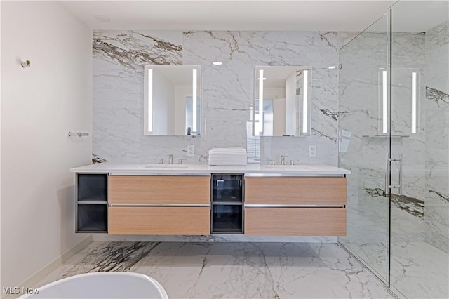 bathroom with vanity and independent shower and bath