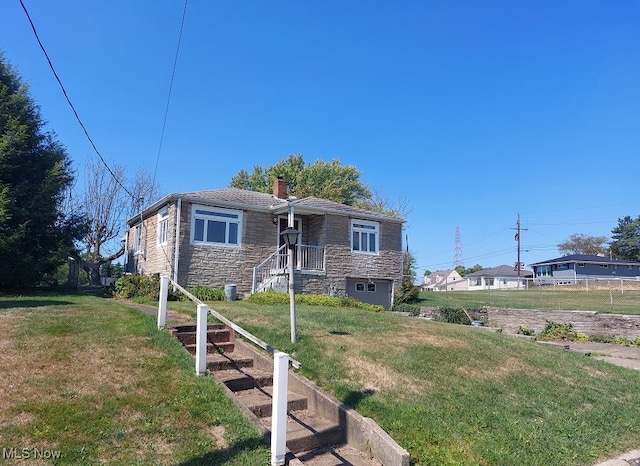 view of front of home with a front yard