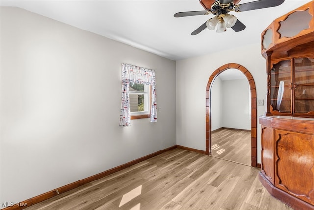 unfurnished room featuring ceiling fan and light wood-type flooring