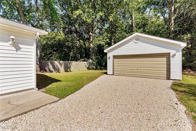 garage featuring a yard