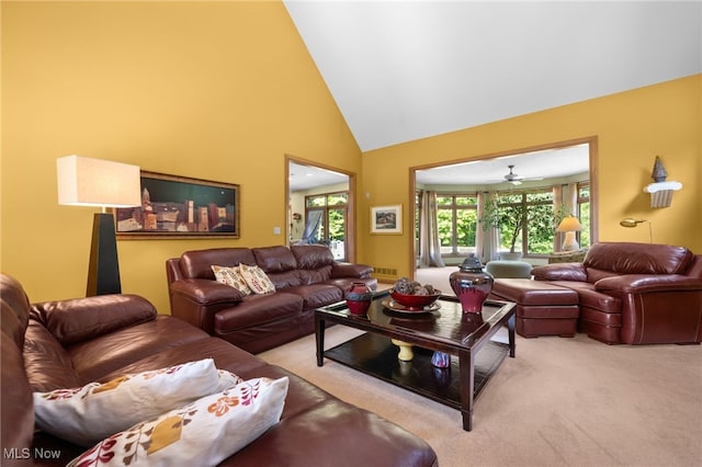 living room with light carpet, high vaulted ceiling, and ceiling fan