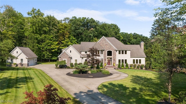 view of front of house with a garage and a front lawn