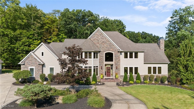 view of front of property with a front lawn