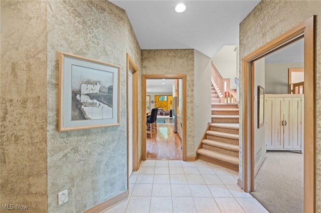 corridor with light tile patterned flooring