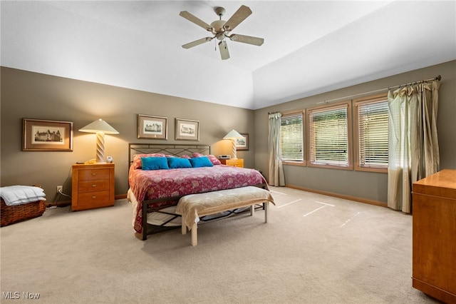 carpeted bedroom with vaulted ceiling and ceiling fan