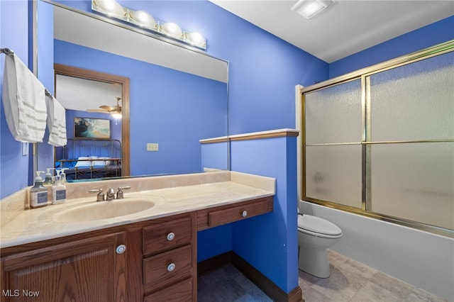 full bathroom with toilet, tile patterned flooring, shower / bath combination with glass door, vanity, and ceiling fan