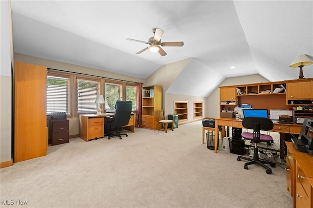 carpeted office space with lofted ceiling and ceiling fan