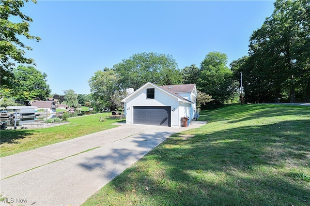 exterior space with a lawn and a garage