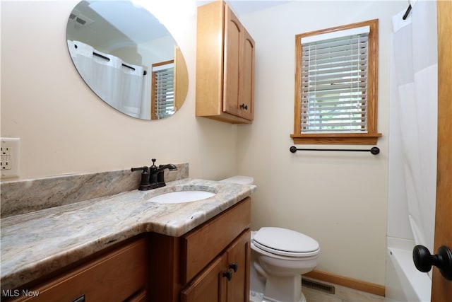 full bathroom featuring vanity, toilet, and shower / bathtub combination