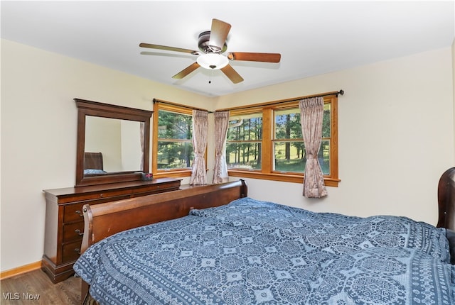 bedroom featuring ceiling fan and hardwood / wood-style flooring