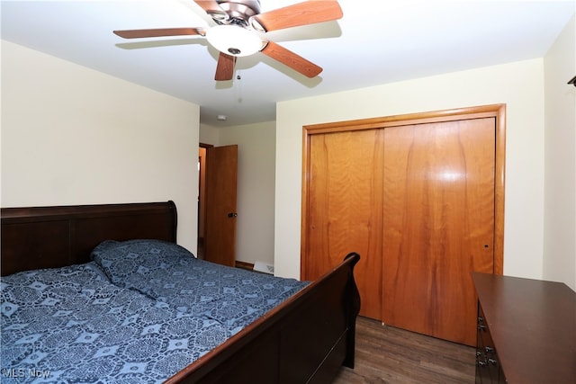 bedroom with a closet, ceiling fan, and dark hardwood / wood-style floors