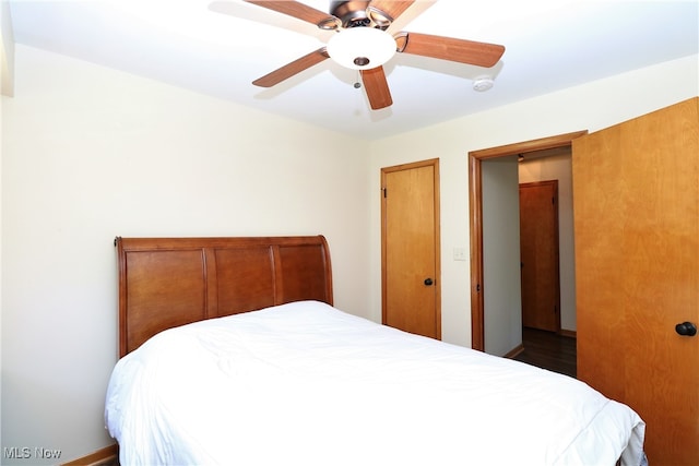 bedroom featuring hardwood / wood-style floors and ceiling fan