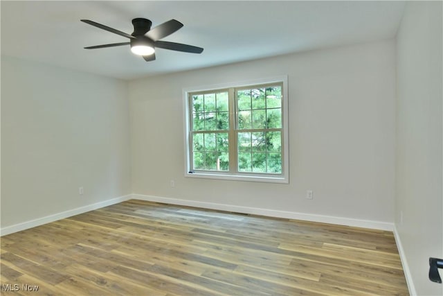 unfurnished room featuring ceiling fan and wood-type flooring