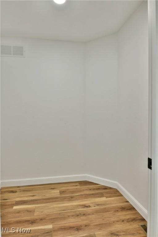 spare room featuring light wood-type flooring