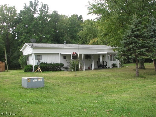 ranch-style home featuring a front yard