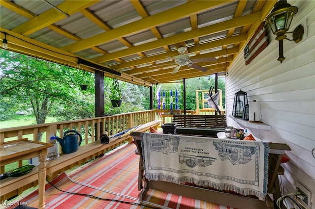 wooden deck featuring ceiling fan