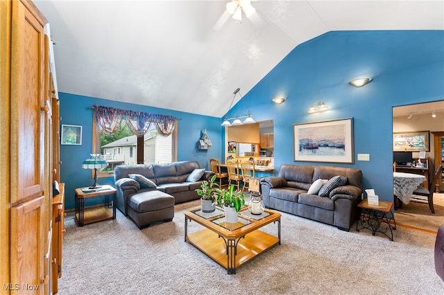 living room featuring ceiling fan, light carpet, and high vaulted ceiling