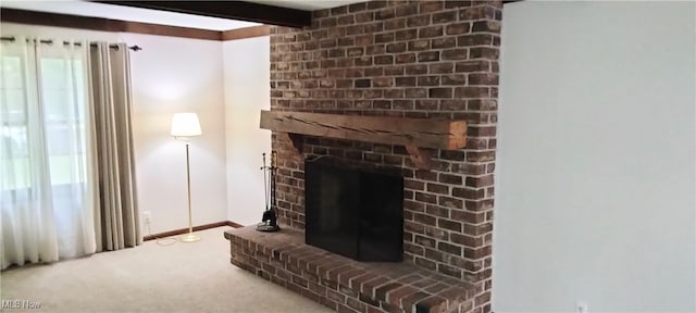 interior space featuring beamed ceiling and a fireplace