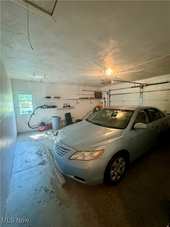 garage featuring a garage door opener