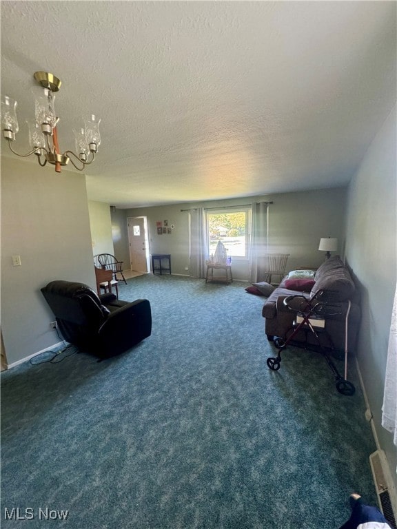 interior space with a textured ceiling, a notable chandelier, and carpet floors