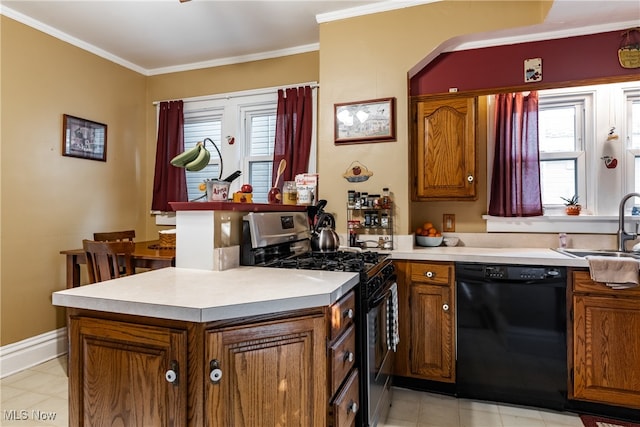 kitchen with a healthy amount of sunlight, black dishwasher, crown molding, and stainless steel gas range oven