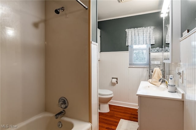 full bathroom featuring hardwood / wood-style floors, toilet, shower / bathing tub combination, and vanity