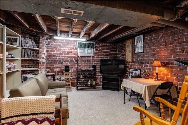 interior space featuring brick wall and carpet floors