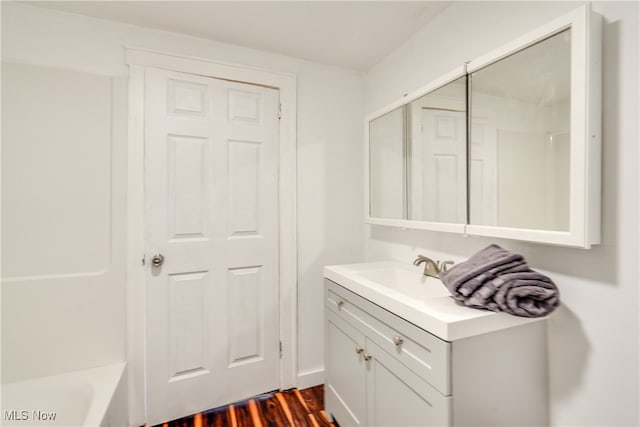 bathroom featuring vanity and wood-type flooring