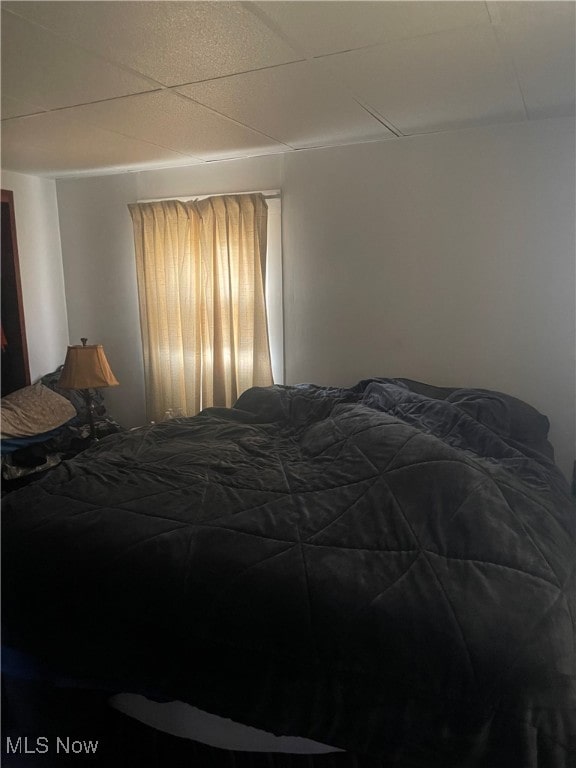 bedroom featuring a drop ceiling