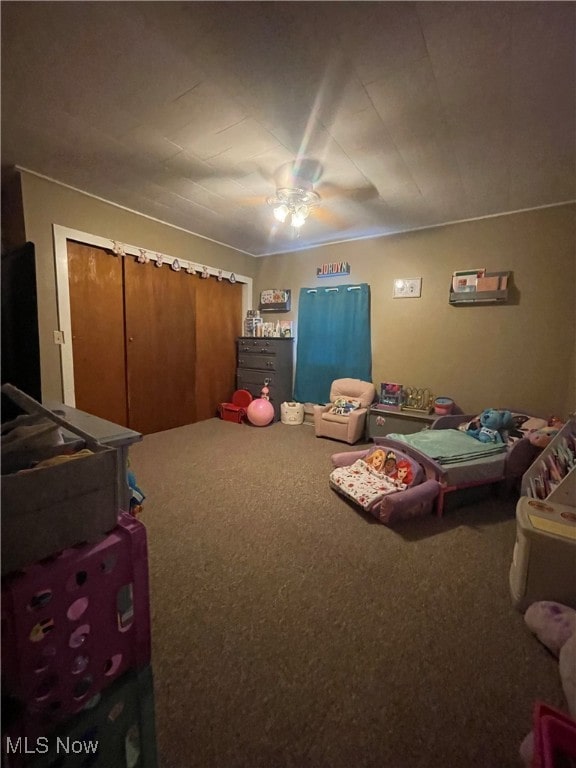 bedroom with ceiling fan and carpet floors