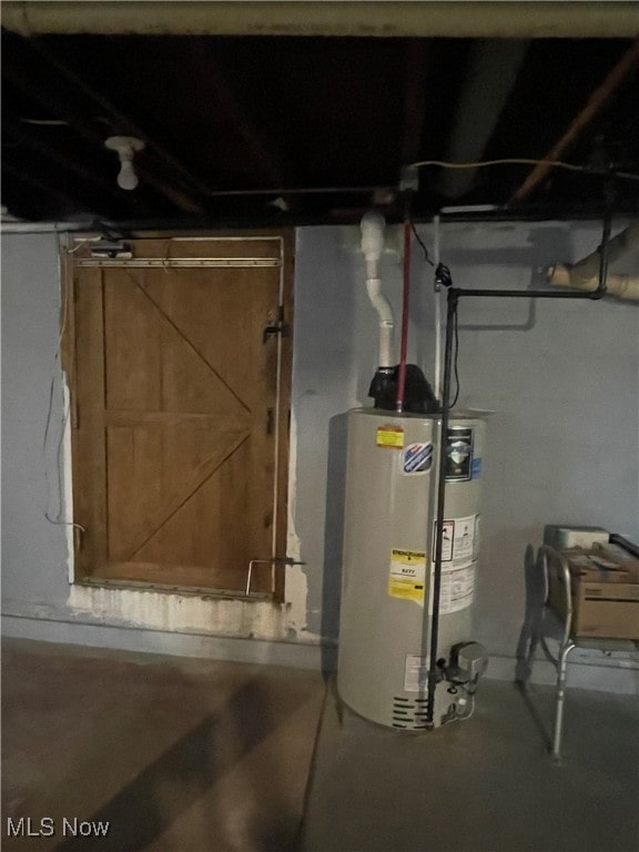 utility room featuring gas water heater