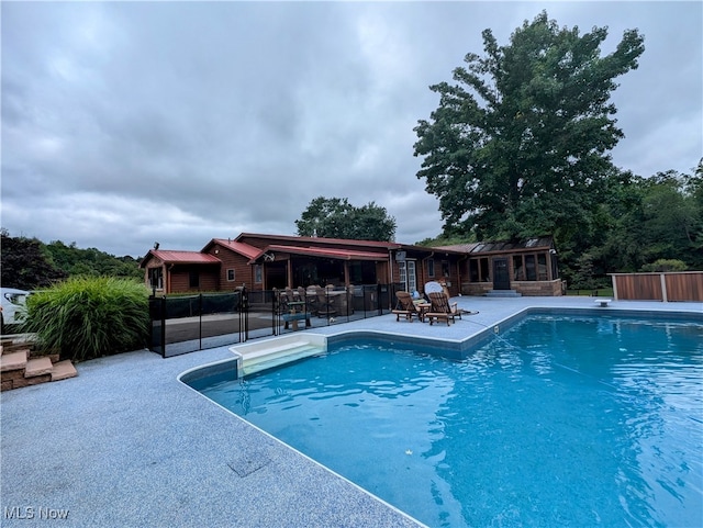 view of pool featuring a patio area