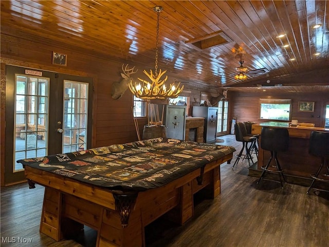 rec room with dark wood-style floors, wood walls, pool table, and wooden ceiling