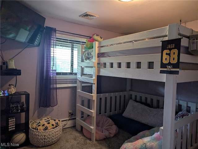 bedroom with carpet floors and a baseboard radiator