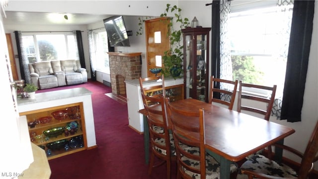 dining room with dark carpet