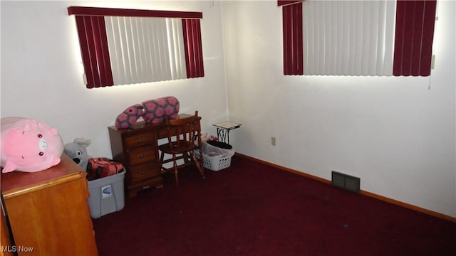 bedroom with dark carpet