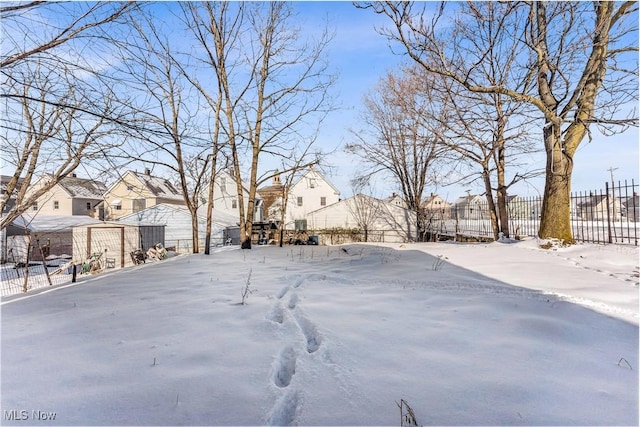 view of yard layered in snow