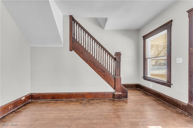 staircase featuring hardwood / wood-style flooring