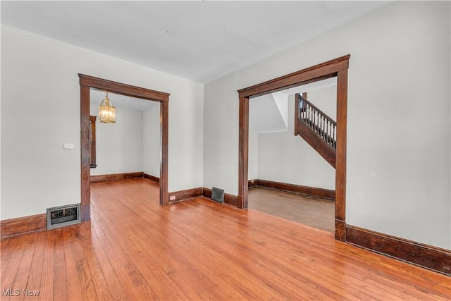 spare room featuring hardwood / wood-style floors