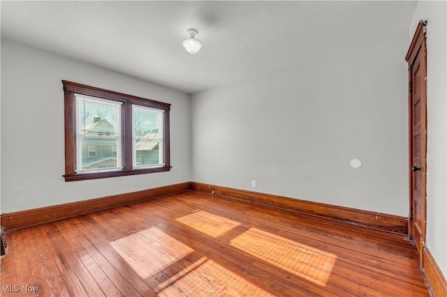 empty room featuring hardwood / wood-style flooring