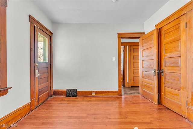 foyer with light hardwood / wood-style flooring