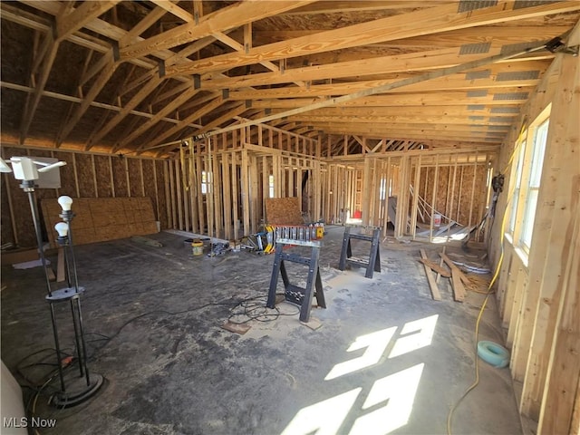 miscellaneous room featuring lofted ceiling