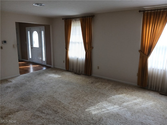 entryway with carpet floors