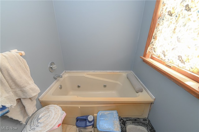 bathroom featuring a washtub