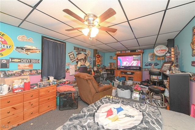 interior space featuring a drop ceiling and ceiling fan