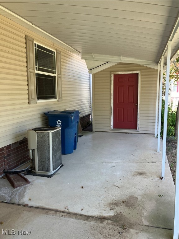 view of patio / terrace with a storage unit