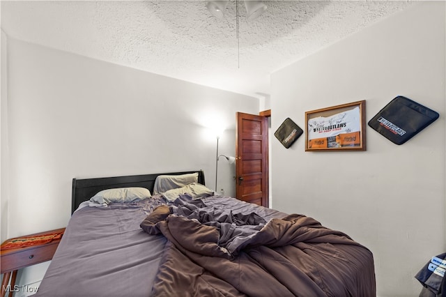 bedroom with a textured ceiling